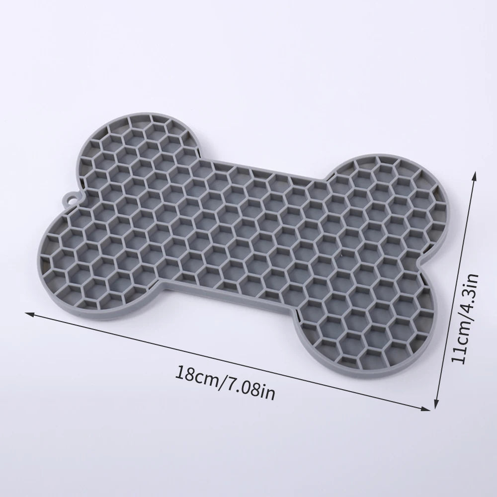 Silicone dog licking pad with bone shape for slow feeding and pet enrichment, suitable for dogs and cats, Showlu Fashion Store.