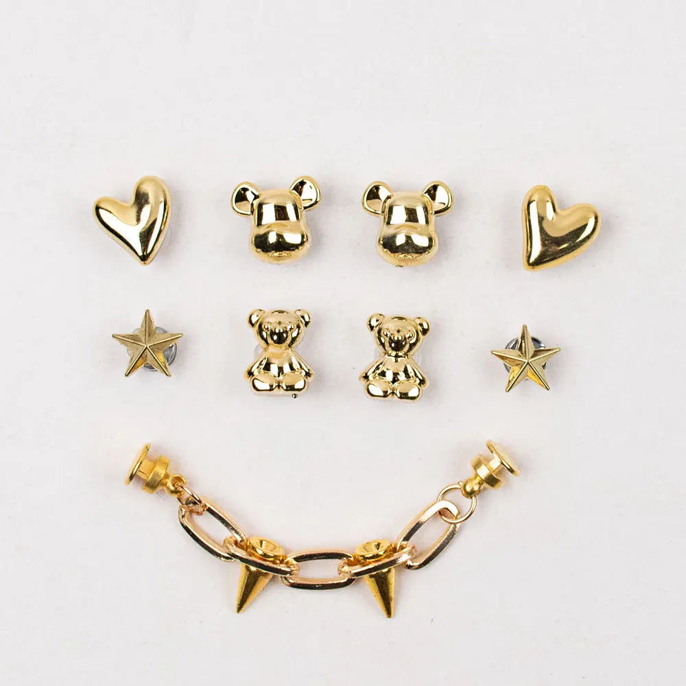 Colorful acrylic shoe charms featuring butterfly, cartoon bear, and decorative buckles for DIY kids' shoe accessories.
