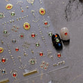 Elegant gold scepter 5D nail art stickers featuring gemstone designs and luxurious courtly patterns for stunning manicures.