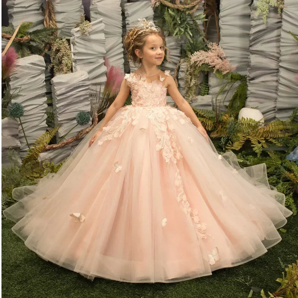 Pink flower girl dress by Showlu Fashion with 3D floral and butterfly appliqué, featuring a delicate and elegant design.
