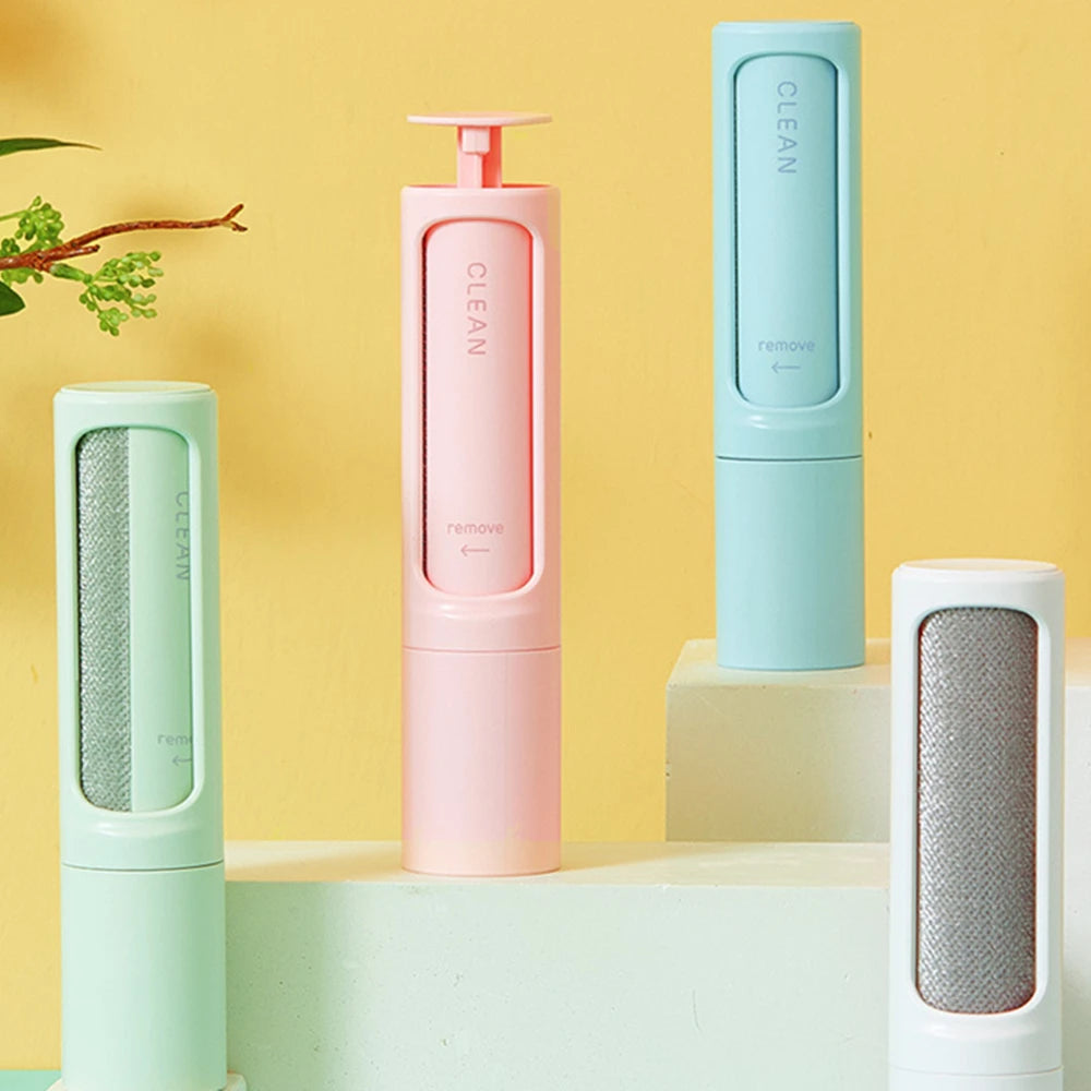 Showlu Smart General reusable pet hair remover lint roller with a handle and sticky surface for removing pet hair from clothing and furniture.