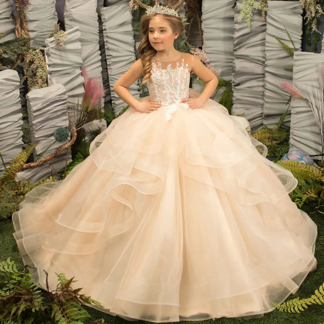 Light champagne flower girl dress by Gdybao featuring a tulle tiered ball gown design, ideal for weddings and special occasions.