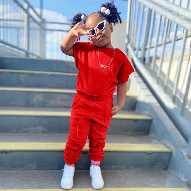 Kids Tales girls' 2-piece cotton T-shirt and pants set for ages 1-6, featuring colorful, comfortable clothing for young children.
