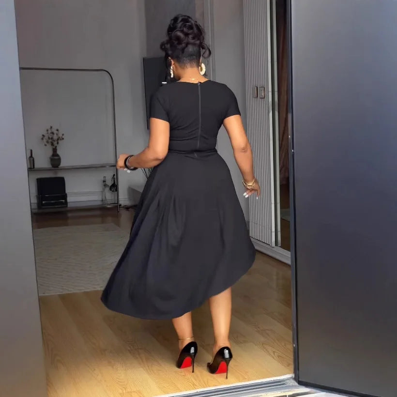 Elegant women's pleated round-neck dress with button details and irregular slit hem, perfect for commuting and stylish 2025 fashion.