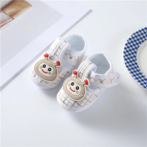 Soft cotton baby first walkers for boys and girls, shown in gentle pastel colors, designed for newborns' comfortable early steps.