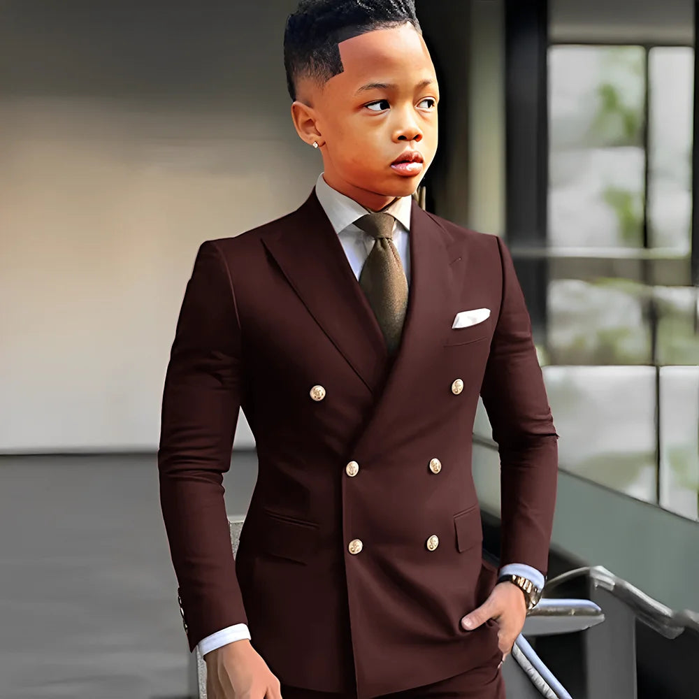 Navy blue solid boy tuxedo suit with peak lapel, double-breasted jacket, and matching trousers for formal occasions and weddings.