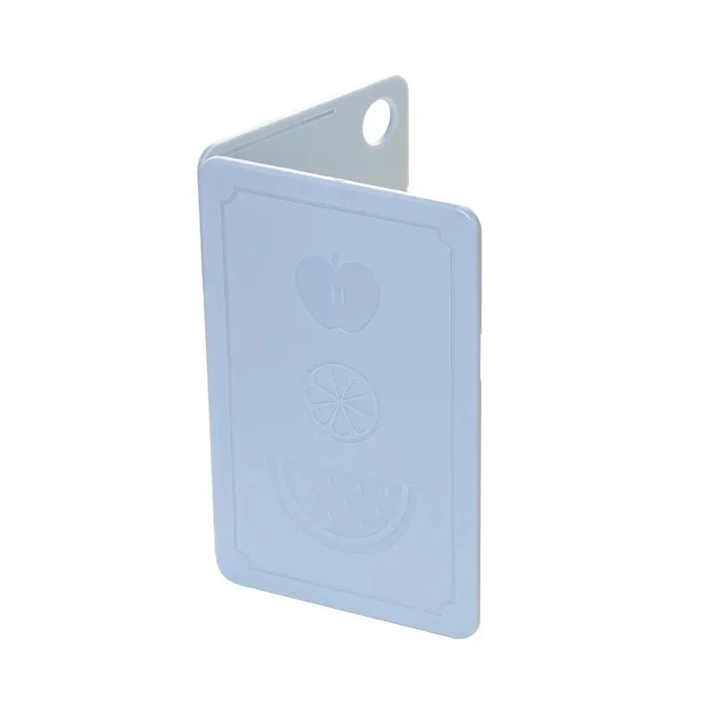 Showlu Smart General collapsible cutting board folded with a textured surface, ideal for space-saving kitchen prep.