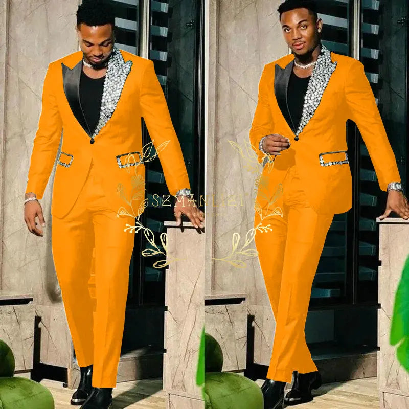 Slim fit black men's suit with single-breasted blazer and matching pants, featuring peak lapel and high-quality crystal details.