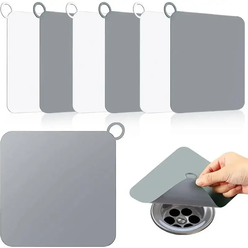 Silicone drain stopper by Showlu Smart General fitting into a kitchen sink drain, flexible and reusable for sealing and preventing clogs.