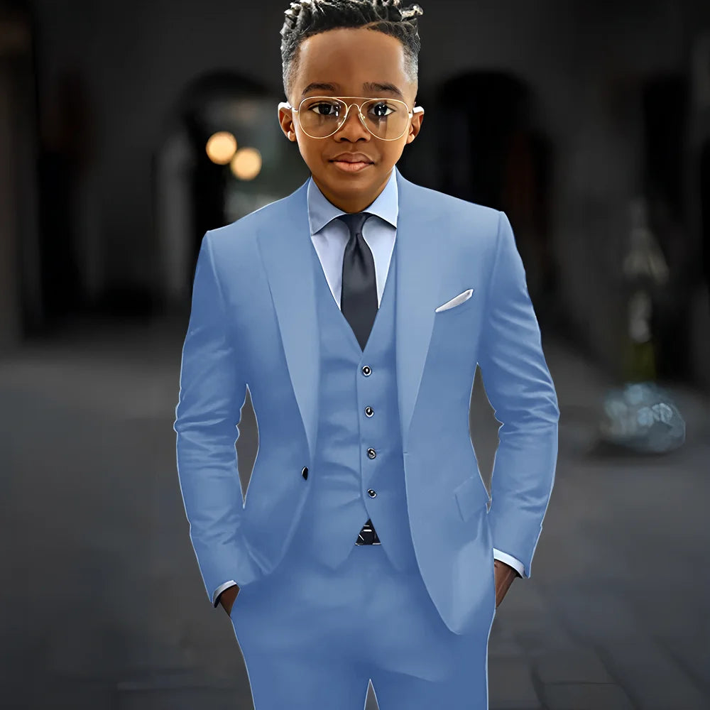 Dark grey boys' 3-piece suit by Showlu Fashion, slim fit with single breasted jacket, peak lapel, including pants and vest.