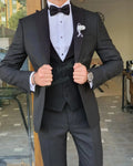 Men's white slim fit suit with peak lapel, 3-piece wedding tuxedo, shown on a mannequin featuring jacket, vest, and trousers.