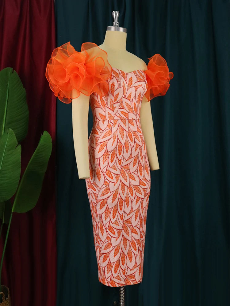 Elegant woman’s off-shoulder floral print dress by Showlu Fashion Store, featuring tulle accents and contrast leaf design for formal events.