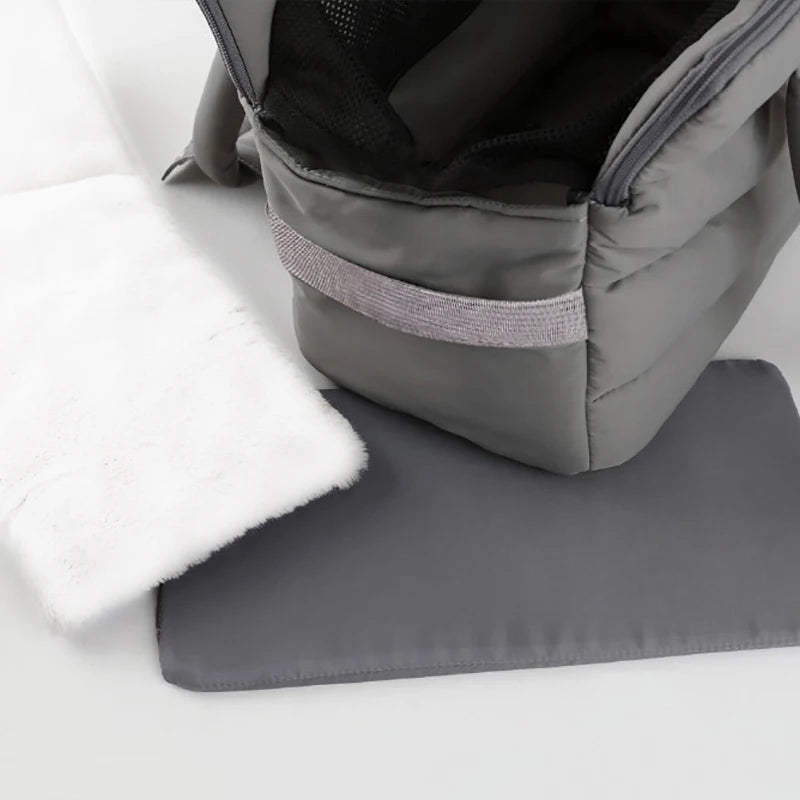 Winter pet carrier bag by Showlu Fashion Store, windproof nylon travel bag with warm lining and included mat for pets.