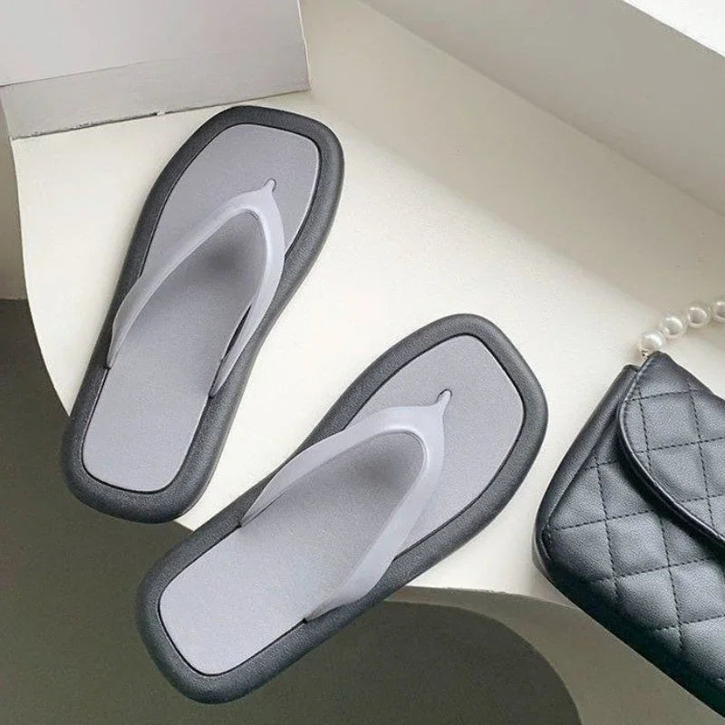 Women's summer flip flops by SHOWLU FASHION STORE, flat PVC slides with a casual, open-toe sandal design.