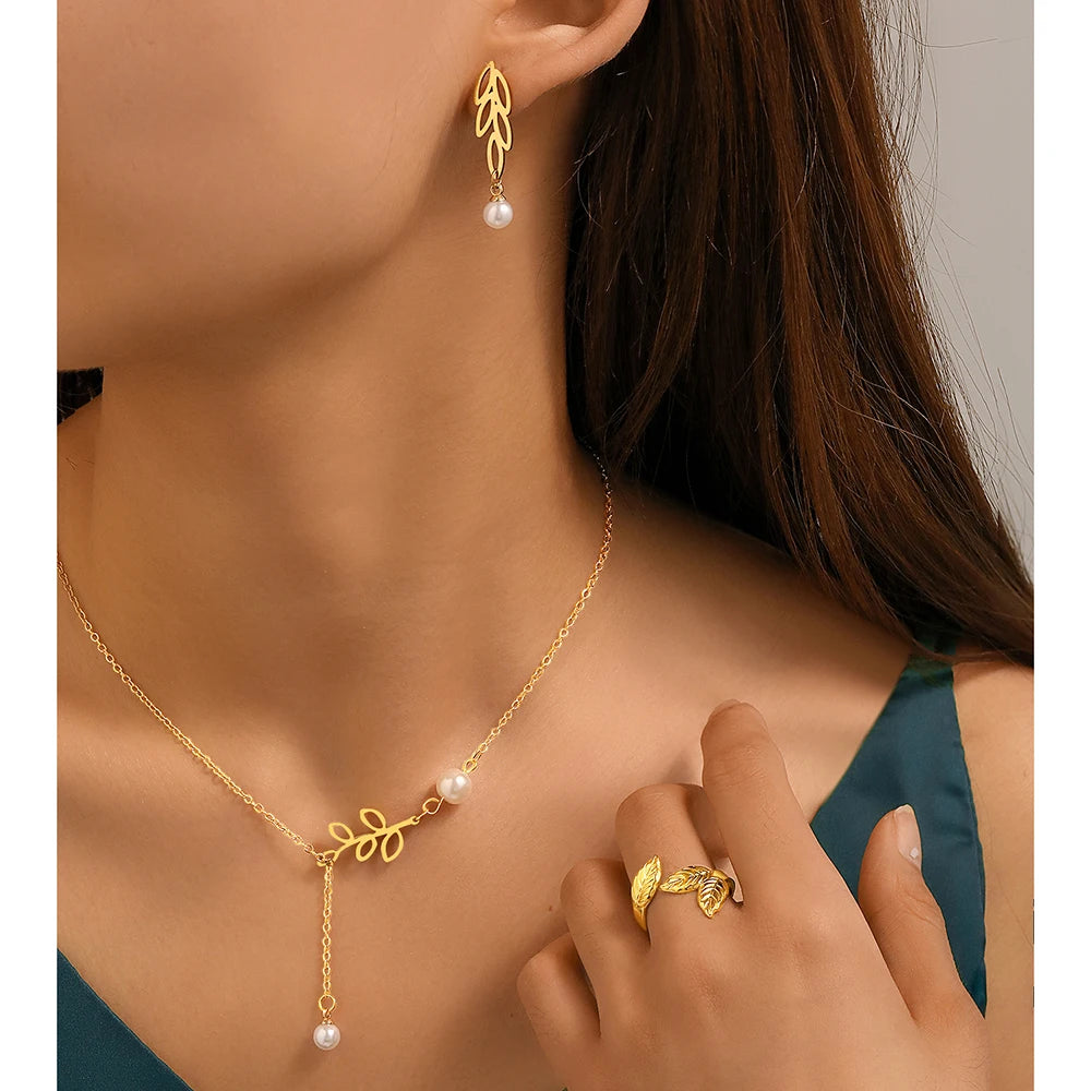 Stainless steel jewelry set with leaf pearl earrings, pearl necklace, and adjustable leaf ring for women, new stylish design.