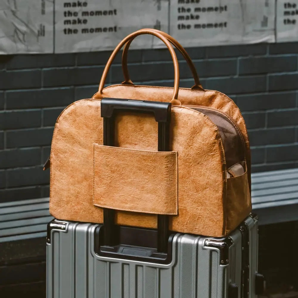 Showlu Fashion YKOSM leather pet carrier bag with windproof design, warm travel bag with included mat for pets.