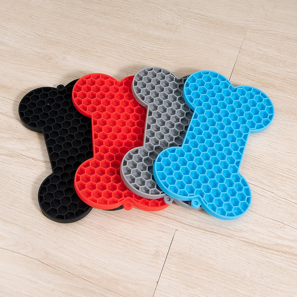 Silicone dog slow food pad with bone design, pet licking mat for dogs and cats, ideal for feeding and soothing pets.