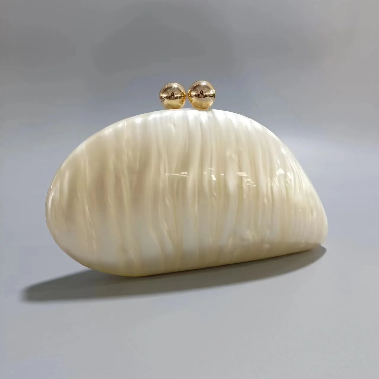 Blue acrylic clutch bag in shell shape with pearl accents, designed for women’s evening parties, by Showlu Fashion Store.