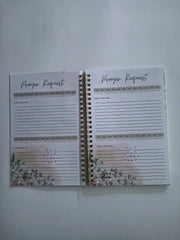 An open spiral-bound prayer journal with floral accents and lined pages for daily requests.
