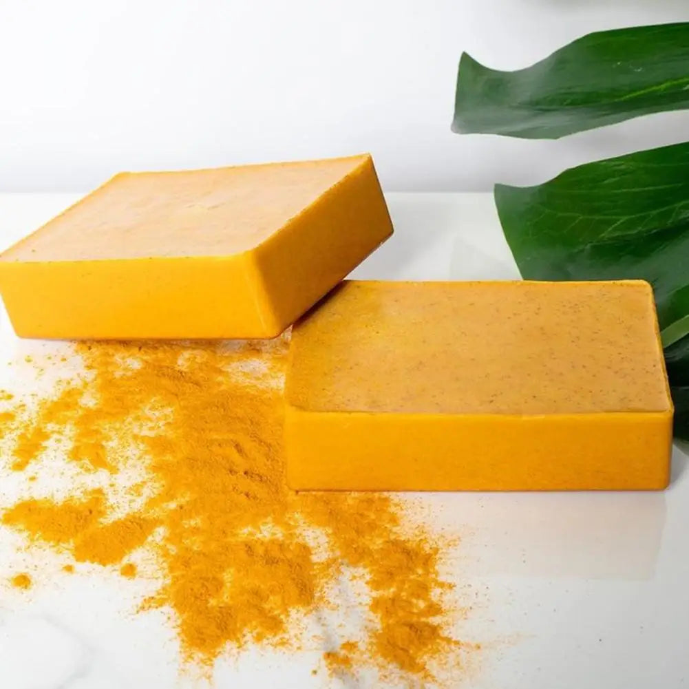 Handmade turmeric and lemon kojic acid soap bar, natural body and facial shower soap, shown in a 100g size package.