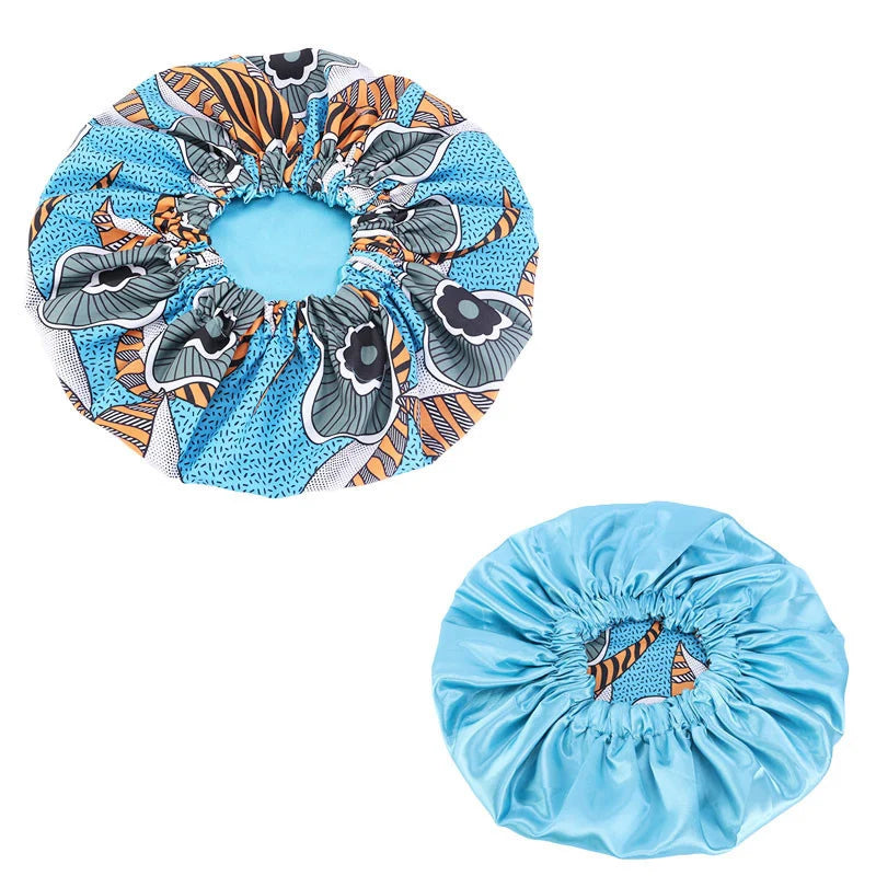Women’s satin-lined sleep cap with African Ankara print, soft extra-large headwrap and hair care bonnet for ladies.