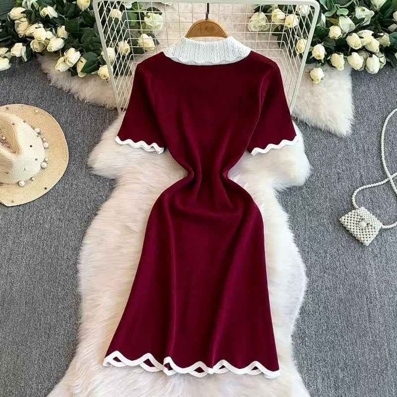 Elegant 2026 summer women's pearl dress by Showlu Smart General featuring a bow collar, short sleeves, and knitted bodycon style.