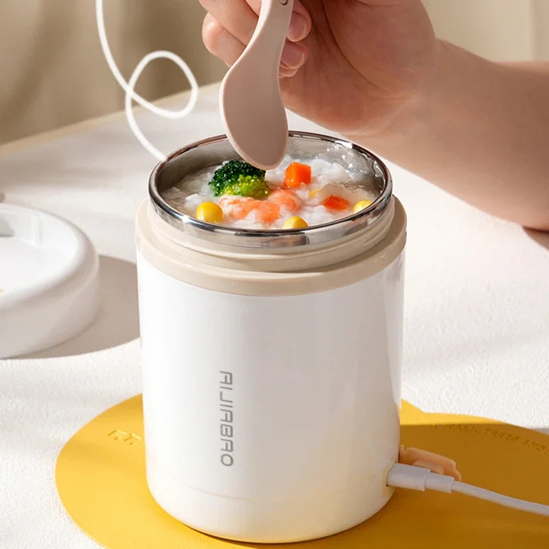 Portable 600ML USB electric lunch box with stainless steel container, suitable for heating food and drinks on the go.