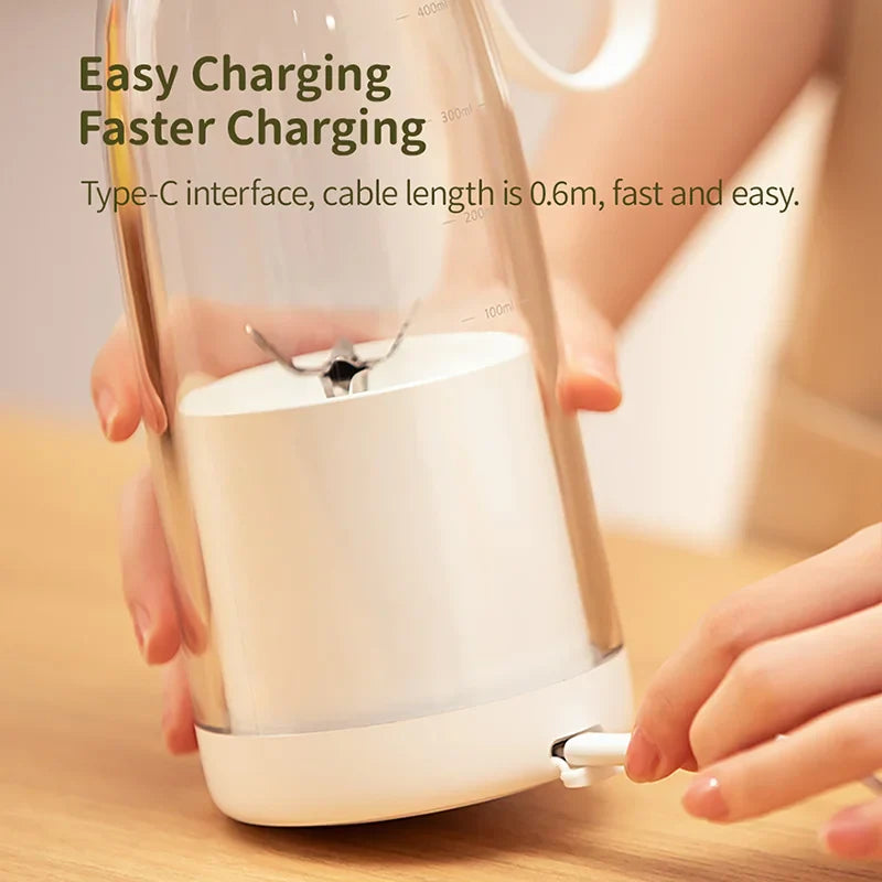 Portable Donirt 500ml wireless blender with 6-blade USB juicer and ice crusher, showing the compact blending device and blades.