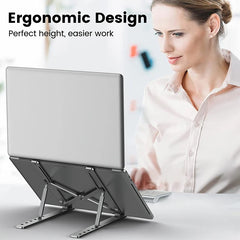 A silver aluminum alloy laptop stand holding a laptop on a desk.