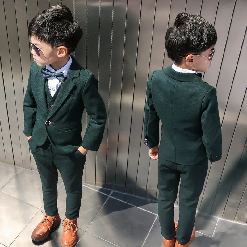 Dark green boys formal wedding suit and tuxedo set by SHOWLU FASHION STORE, includes jacket, pants, vest, and shirt for special occasions.