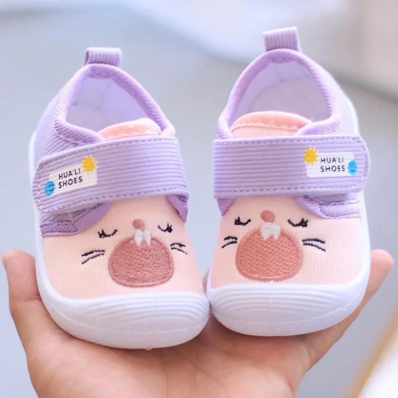 Showlu Fashion Baby Cartoon Squeaky Shoes with non-slip canvas soles, perfect for first walkers and toddler adventures.