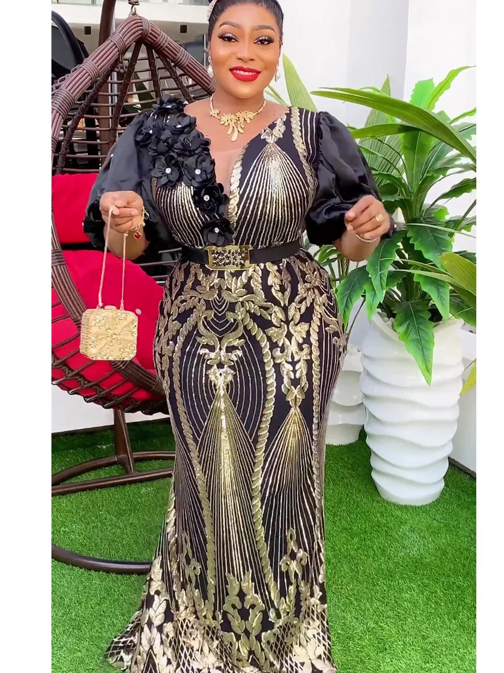 SHOWLU FASHION DASHIKI Ankara sequin bodycon maxi evening gown, featuring vibrant patterns and shimmering details, worn by a woman.