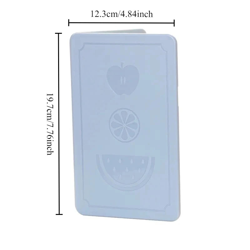 Showlu Smart General collapsible cutting board folded with a knife and vegetables ready for chopping on the surface.