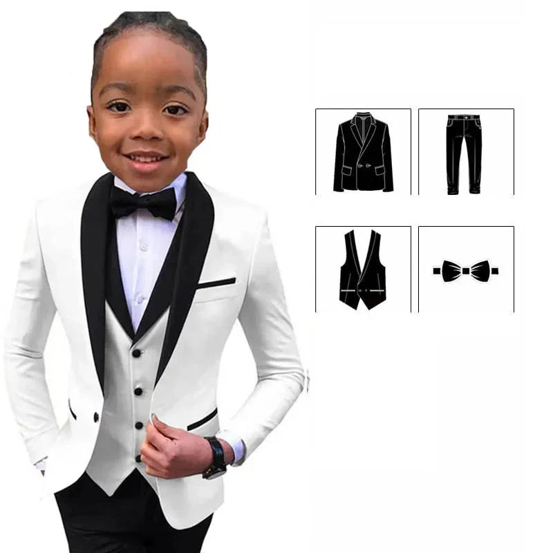 Boy wearing a white slim fit suit with jacket, vest, pants, and bowtie from PsyMonster Boys 4-piece suit by SHOWLU FASHION STORE