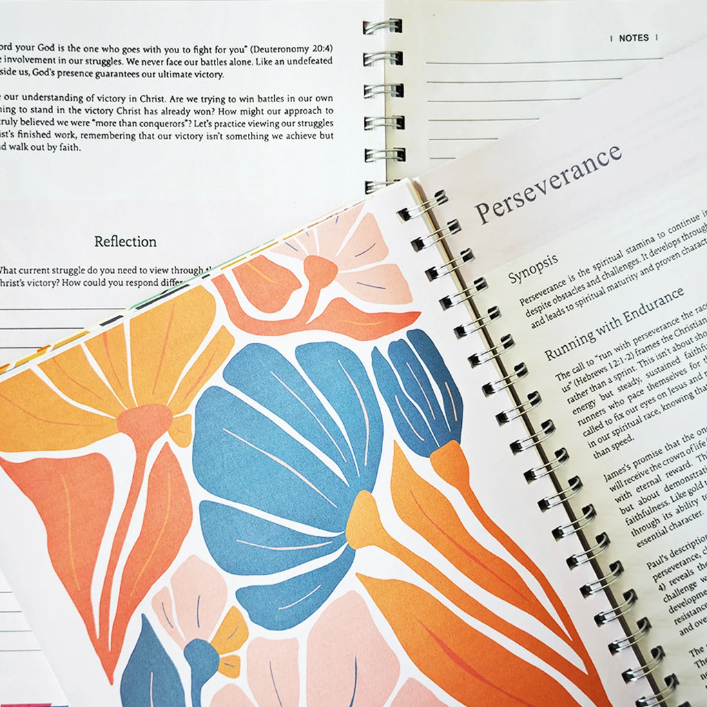 Spiral-bound women's Bible in a Year devotional journal with 52 weekly entries, featuring inspirational religious content.