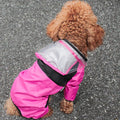 Transparent waterproof dog raincoat with hood, polyester jumpsuit by Showlu Fashion Store, designed to keep dogs dry in wet weather.