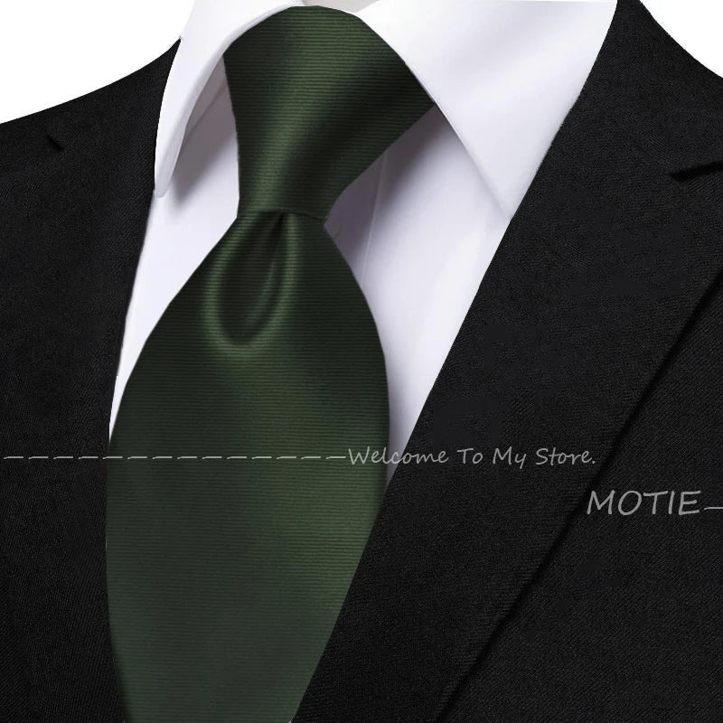 Men's sage green tie set with pocket square, flower brooch, cufflinks, and collar accessory for wedding or daily wear.