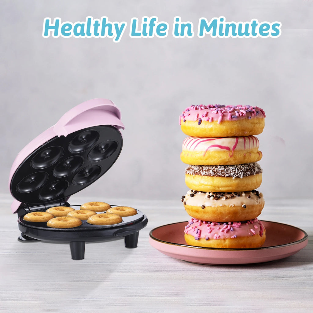 Homgeek 7-hole mini donut maker by Showlu Smart General, showing a compact black appliance with stainless steel accents and freshly made mini donuts.