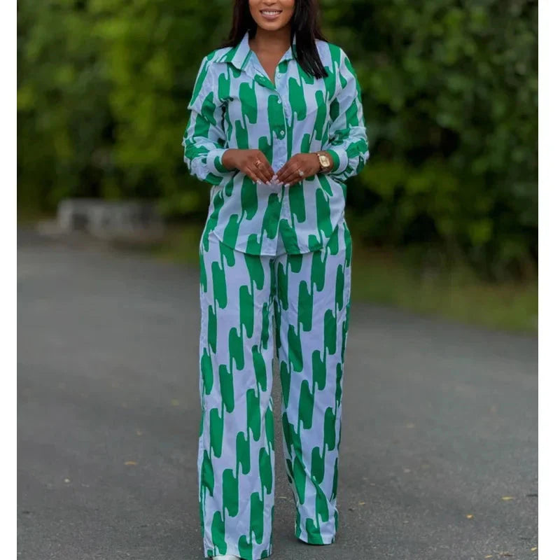 African stripe print two-piece set from SHOWLU FASHION with long sleeve shirt and wide-leg pants, featuring bold geometric patterns.