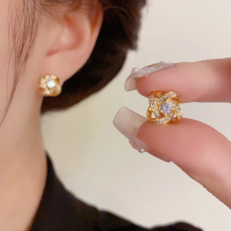 Showlu Fashion zircon cross stud earrings with geometric copper design, featuring sparkling stones and modern jewelry style.
