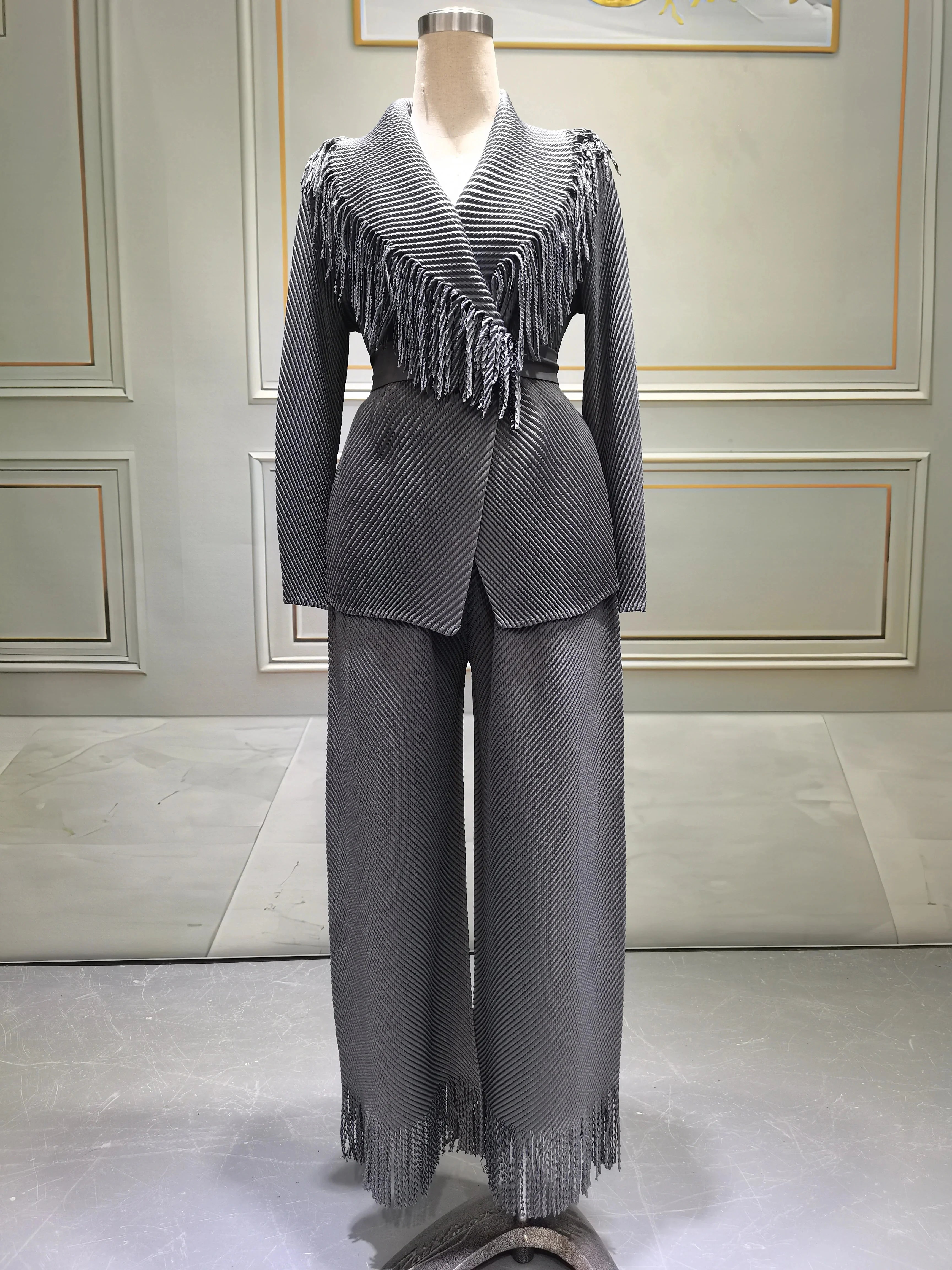 Miyake Folds women's fringe lapel coat and straight skirt two-piece set, shown in black with stylish fold details and modern design.