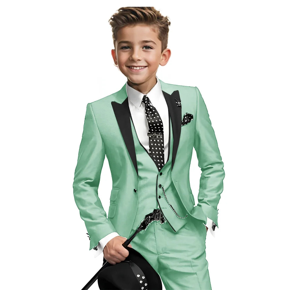 Navy blue boys' tuxedo 3-piece suit with blazer, pants, and vest, suitable for weddings and formal occasions, ages 2-16 years.