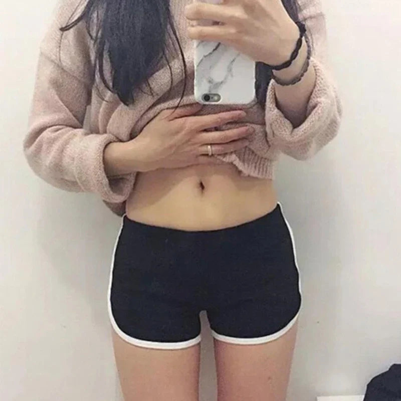 Black SHOWLU women's high performance yoga shorts designed for gym and running, featuring a comfortable fit and breathable fabric.