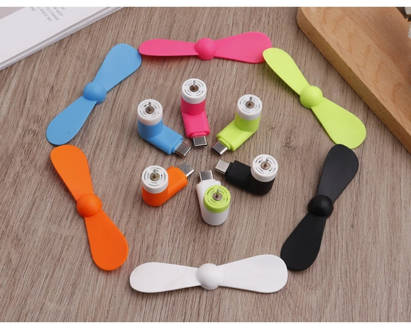 Showlu Smart General USB Mini Fan showing compact design and adjustable blades for portable cooling.