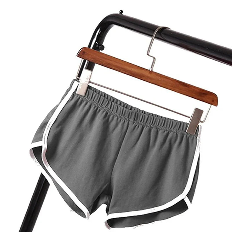 Black SHOWLU Women's High Performance Yoga Shorts for gym and running, made with breathable fabric for active wear.