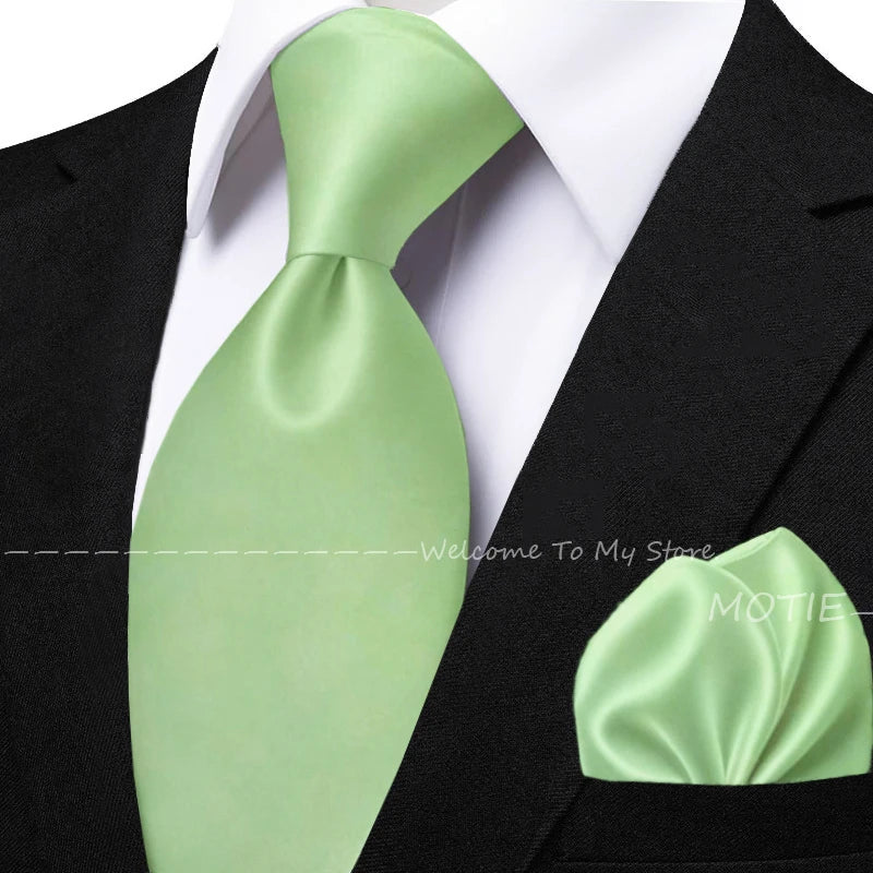Men's sage green tie set with pocket square, flower brooch, cufflinks, and collar accessories for wedding or daily wear.