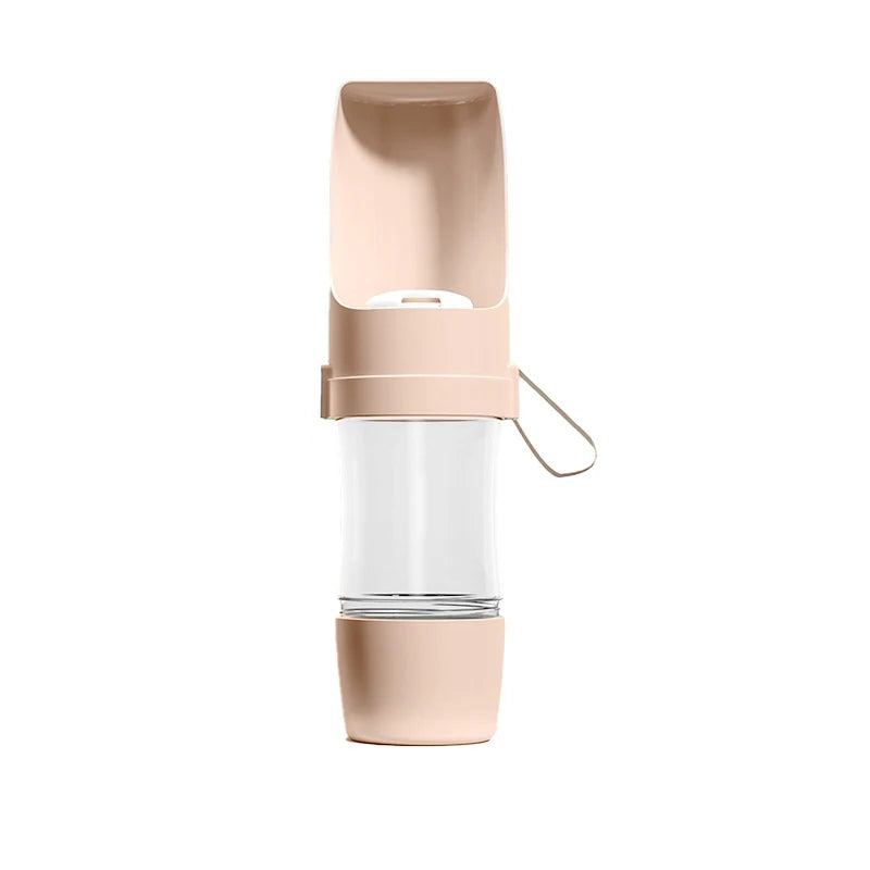 Showlu 2-in-1 portable pet travel water bottle and food container, 500ml, with clear drinking and food compartments for pets.