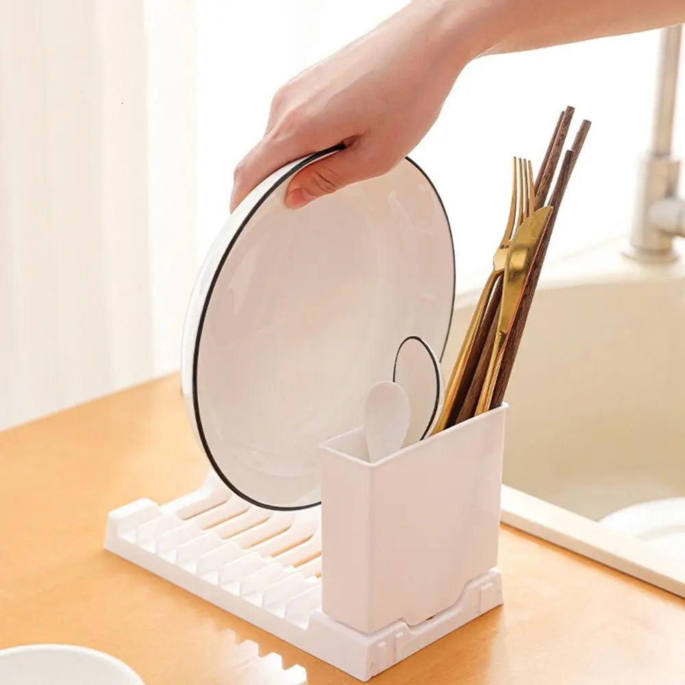 Foldable Showlu Smart General dish drying rack with multiple slots and foldable design for easy storage, shown in a kitchen setting.
