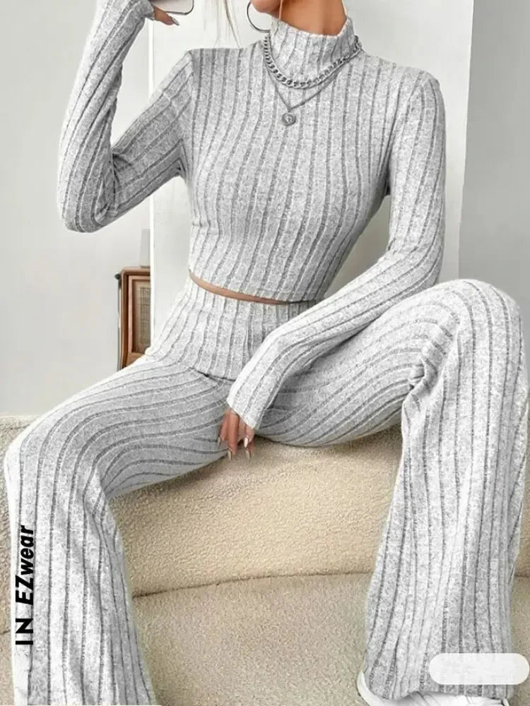 Women’s fashion two-piece streetwear set with solid color round neck top and loose pants, perfect for autumn winter casual wear.
