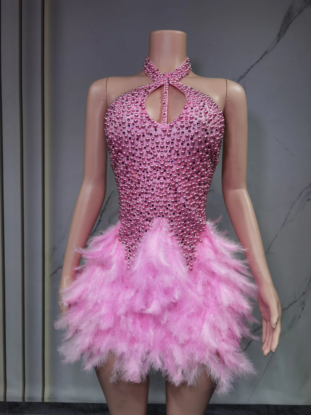 Sexy Latin dance dress by Showlu Fashion Store featuring airy hollow design and feather skirt with hanging neck detail.